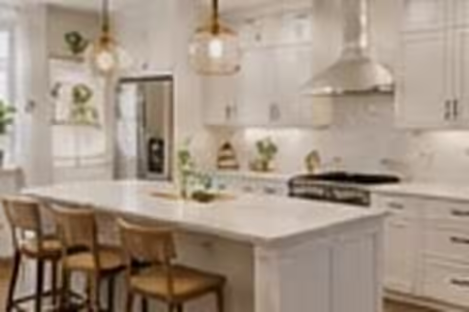 Kitchen island with a softened curved edge in a residential kitchen