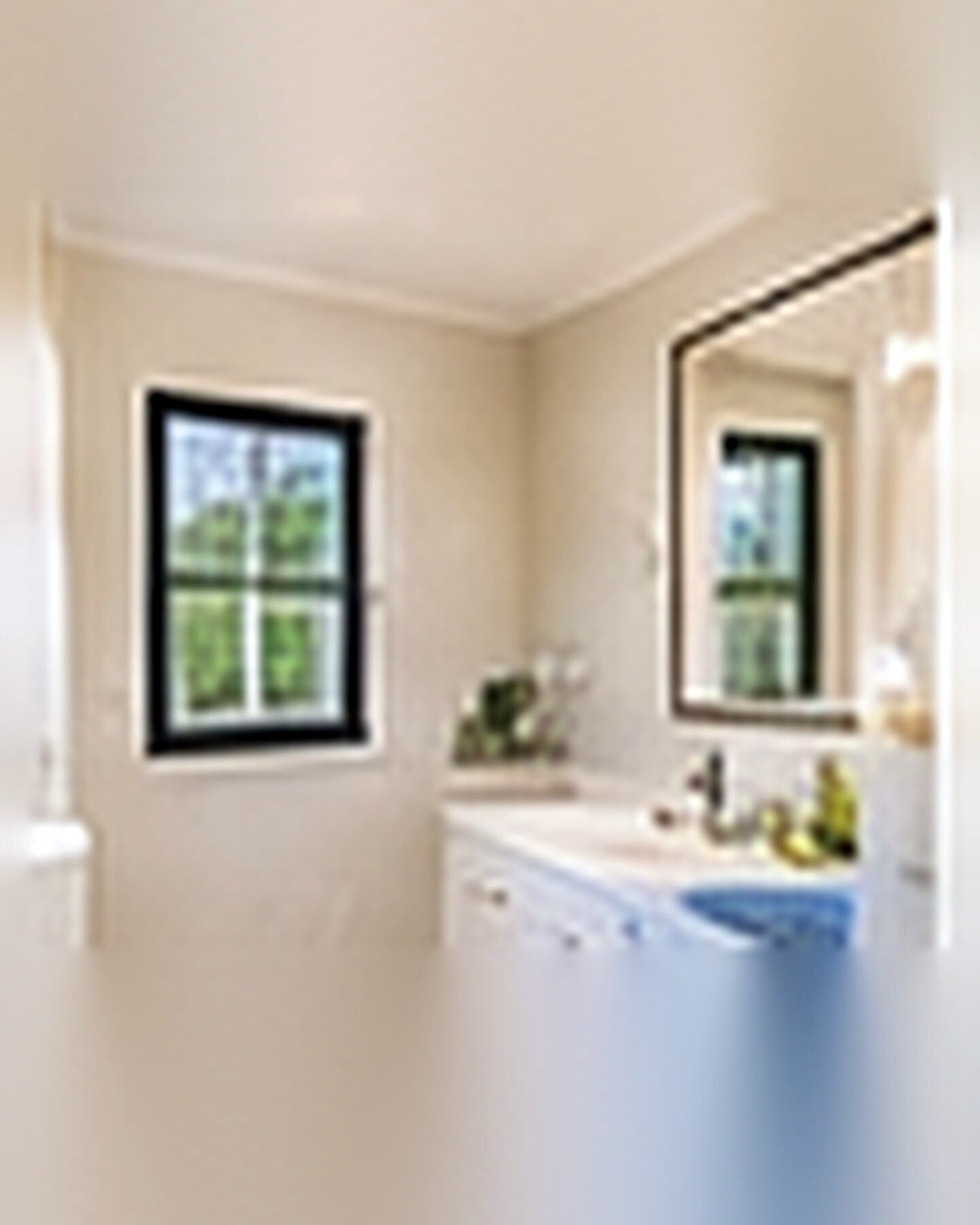 After transformation: Small Bathroom to Spacious-Feeling Retreat: Use Light, Scale and Storage